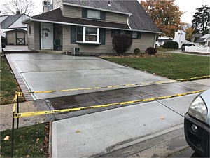 wet concrete driveway levittown brick border